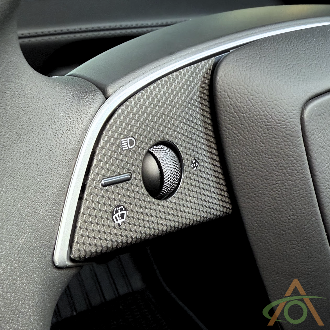Matrix Black (close-up) steering wheel decals for the Refreshed Model 3 or Y (shown on a Model Y wheel)