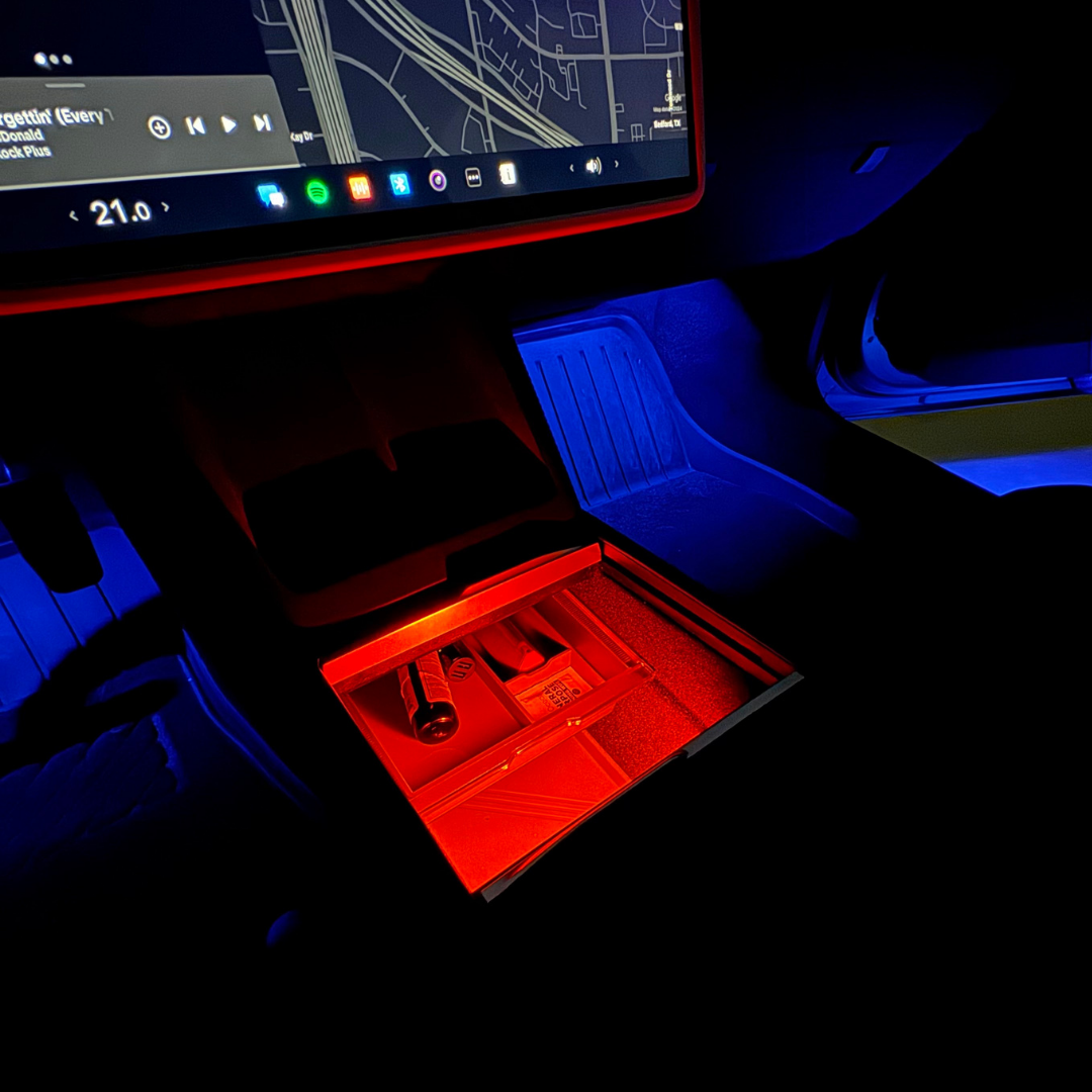 Blue footwells with a red center console light in the Refreshed Model Y (Juniper)