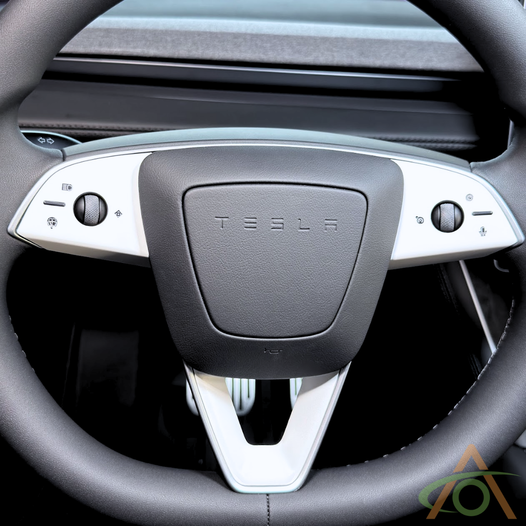 Satin White steering wheel decals for the Refreshed Model 3 or Y (shown on a Model Y wheel)