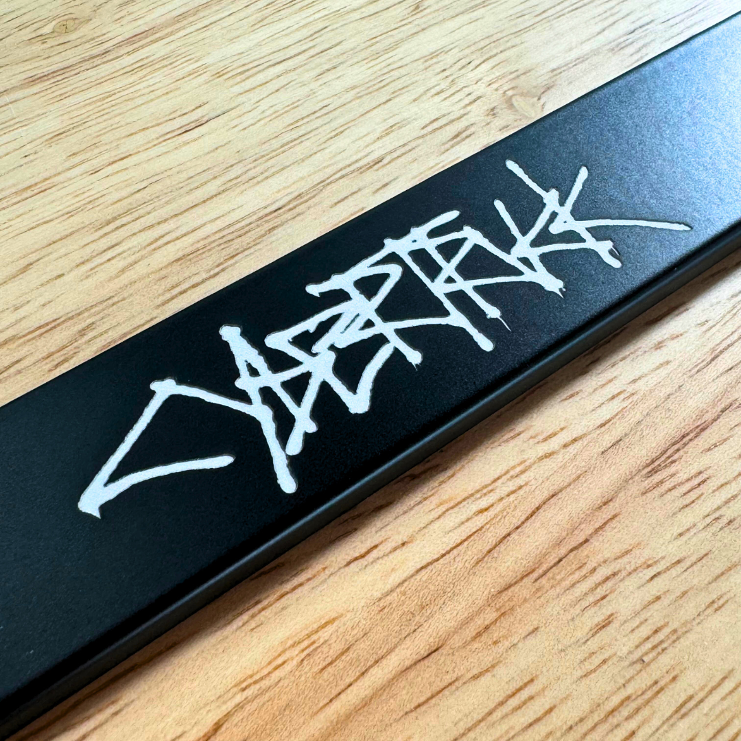 Detail shot of the laser-etched reveal of the Cybertruck graffiti