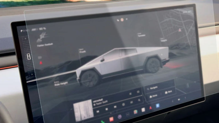 A clear screen protector held over the center touchscreen of a Tesla Cybertruck, showing the vehicle controls screen beneath it