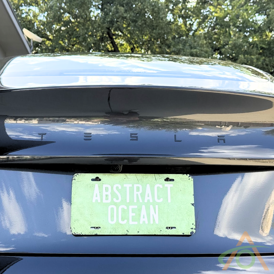 Refreshed satin black low-profile Tesla emblem badge replacement