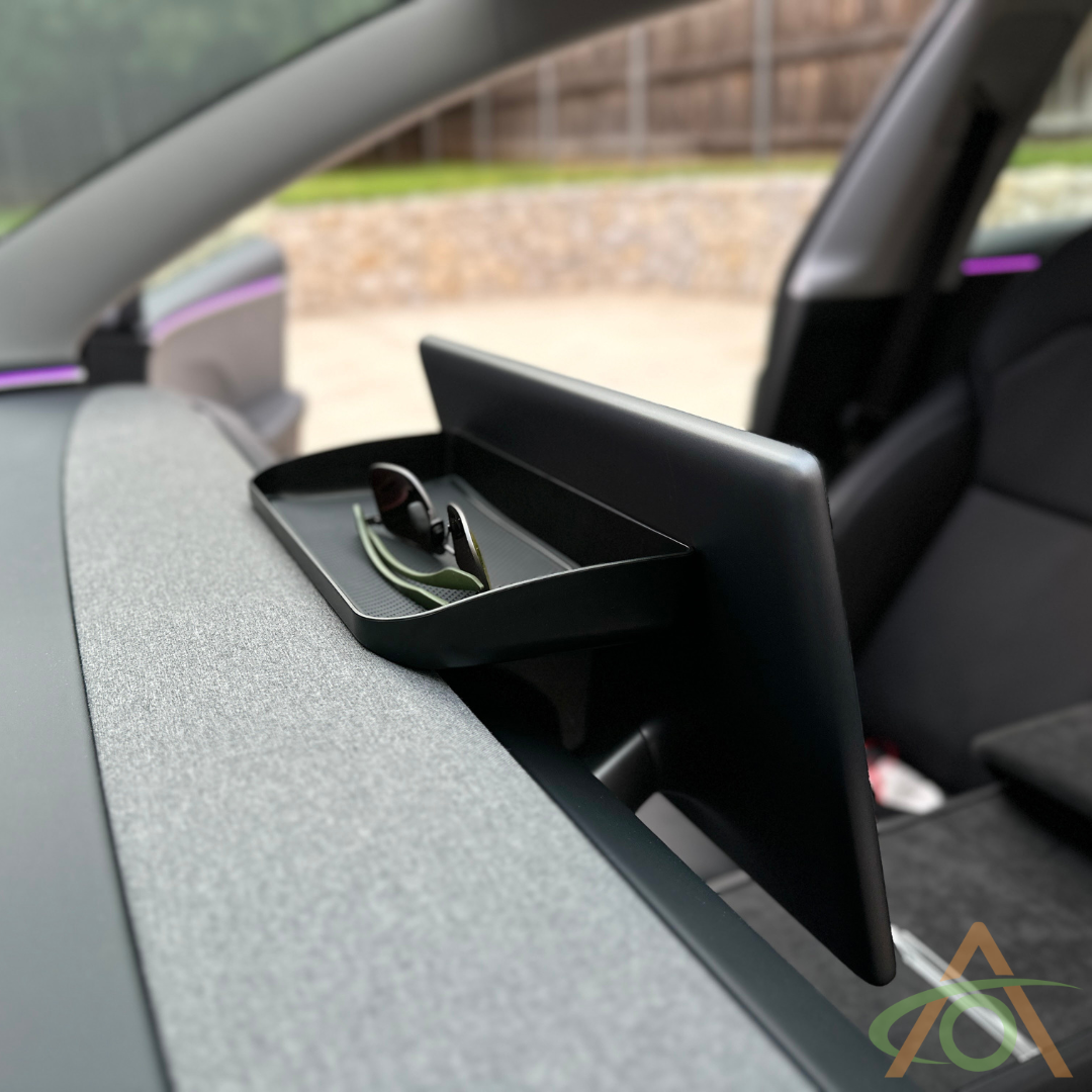Fits behind the screen completely, so invisible from inside the car