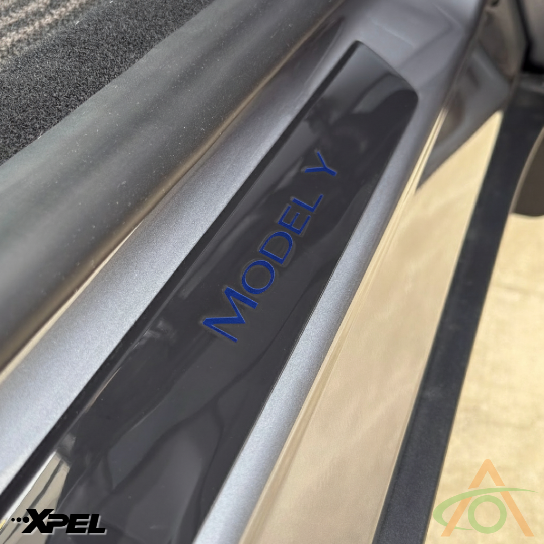 Xpel gloss PPF sill protector with blue wordmark decal for Model Y