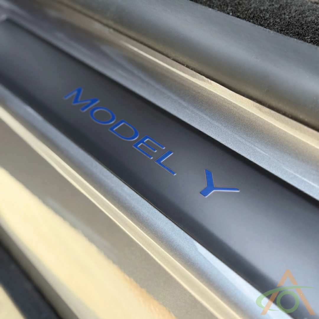 Xpel matte PPF sill protector with blue wordmark decal for Model Y