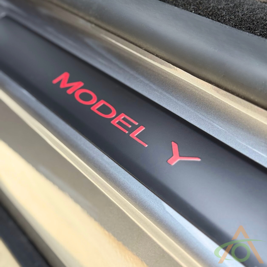 Xpel matte PPF sill protector with red wordmark decal for Model Y